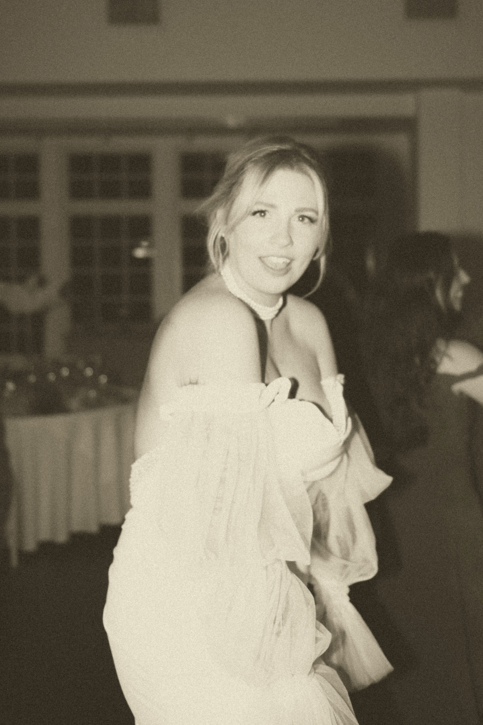 Packed dance floor at The Manor House reception in vintage tone