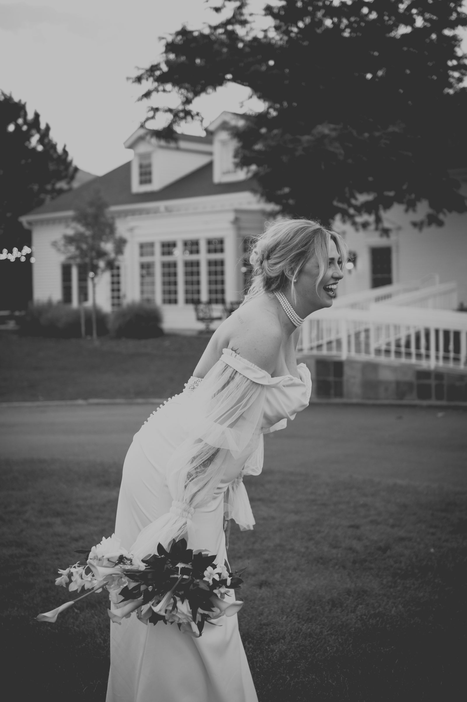 Bride looking back over her shoulder in a vintage styled portrait