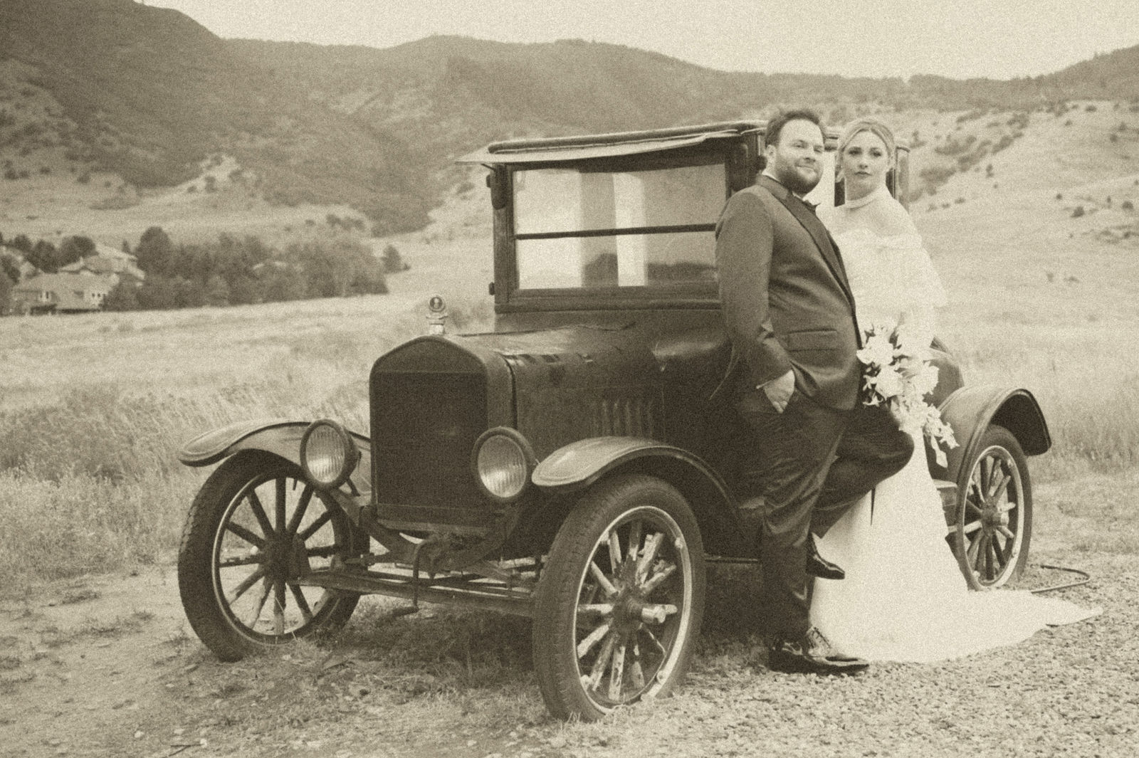 Bride and groom beside a vintage car for old Hollywood wedding portraits
