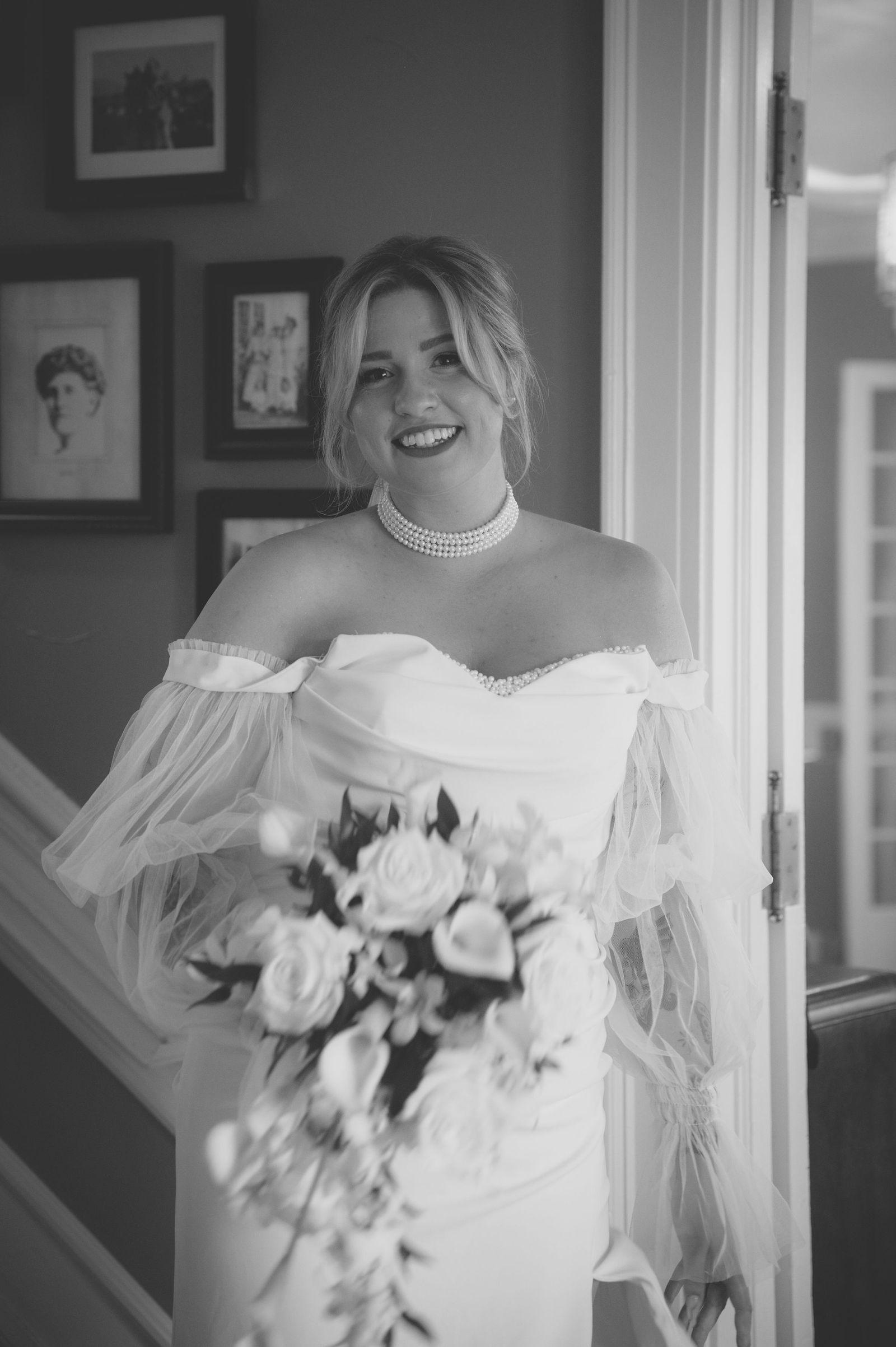 Bride holding her bouquet after the ceremony in warm sepia tone
