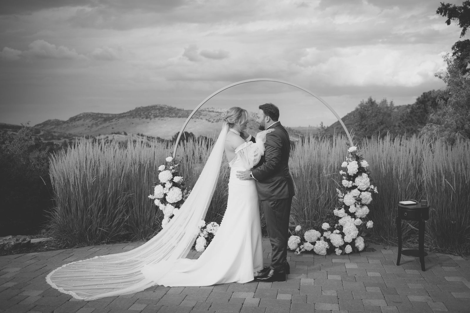Bride and groom kissing at the end of their outdoor ceremony