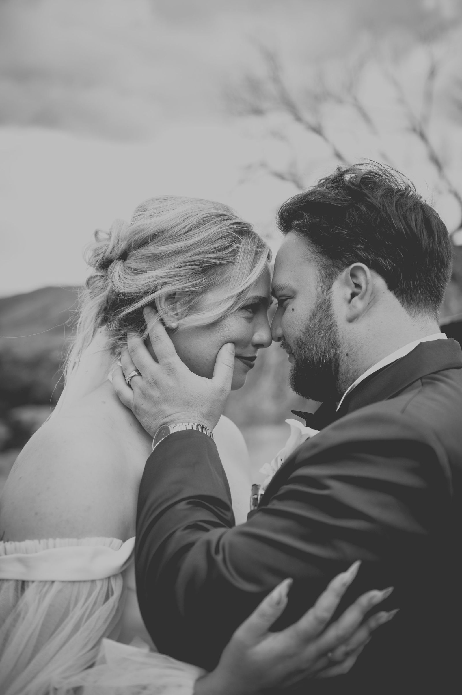 Close kiss between the bride and groom edited in old Hollywood tone