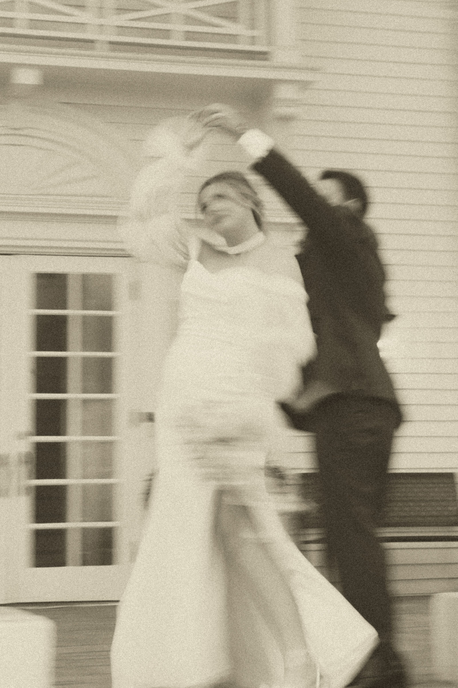 Bride twirling her gown on the lawn in a 1940s inspired portrait