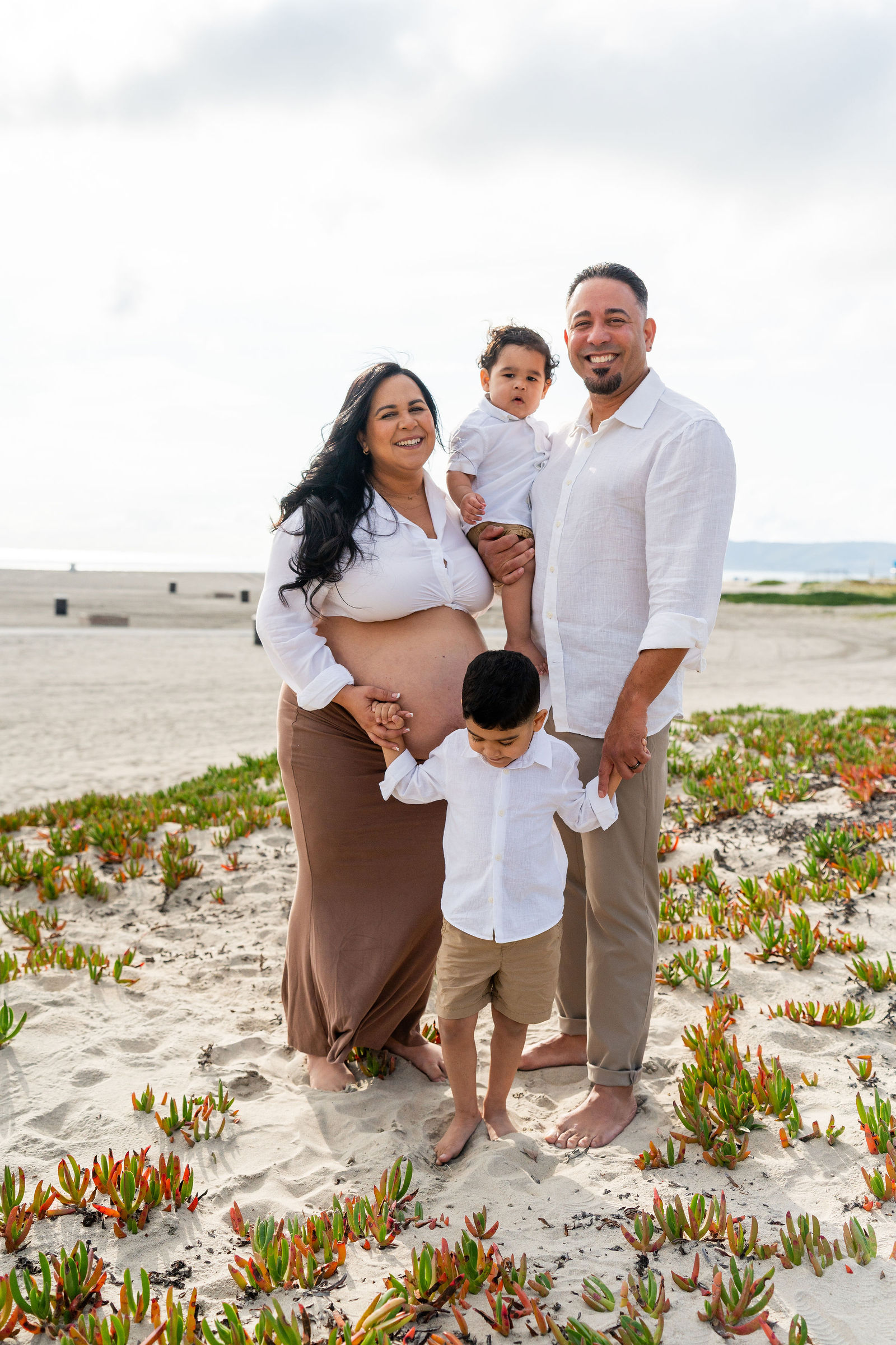 Family members embracing during a milestone celebration in San Diego