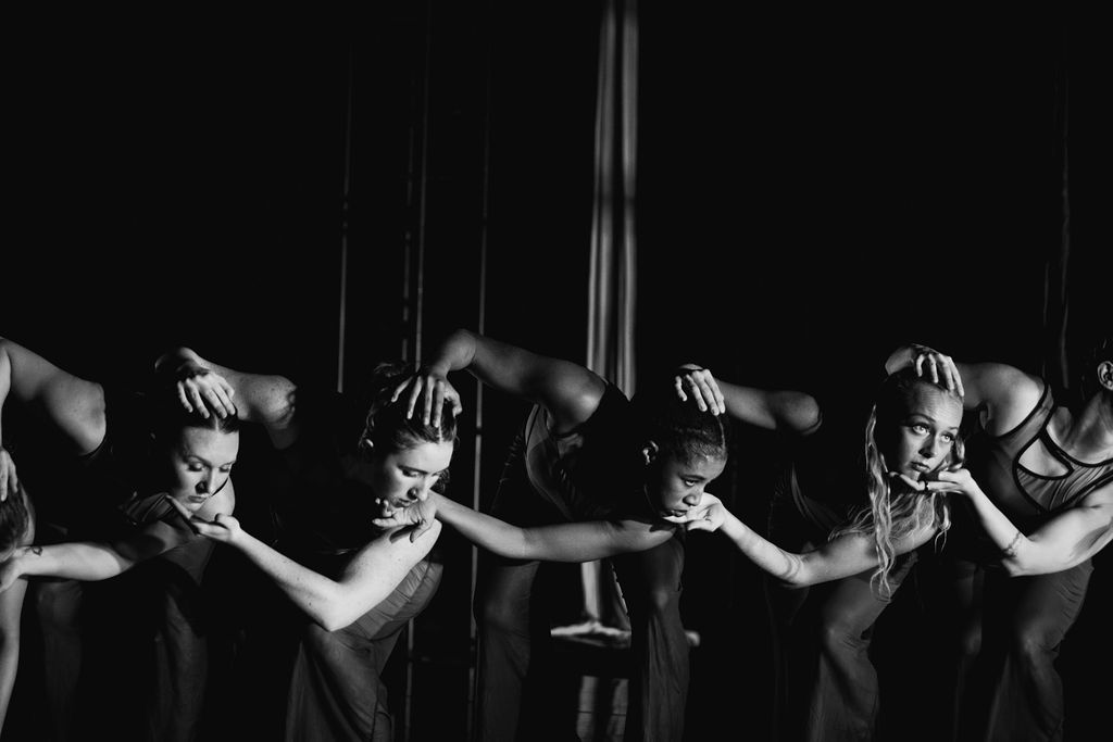 Event photography company capturing a dramatic black-and-white group performance moment