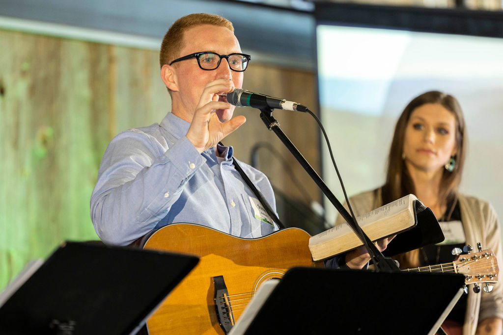 A worship leader singing