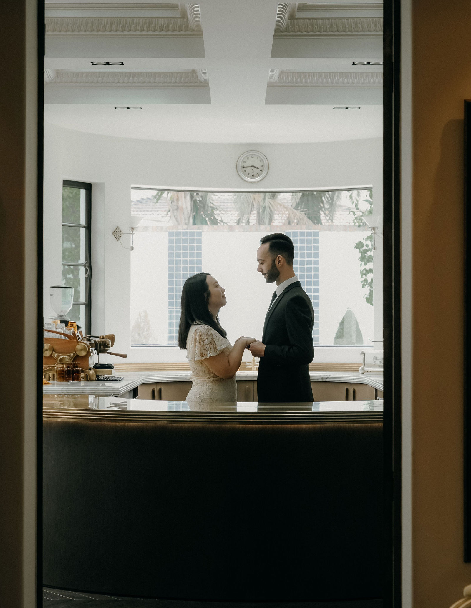 Couple embracing in warm evening light at a Melbourne micro wedding