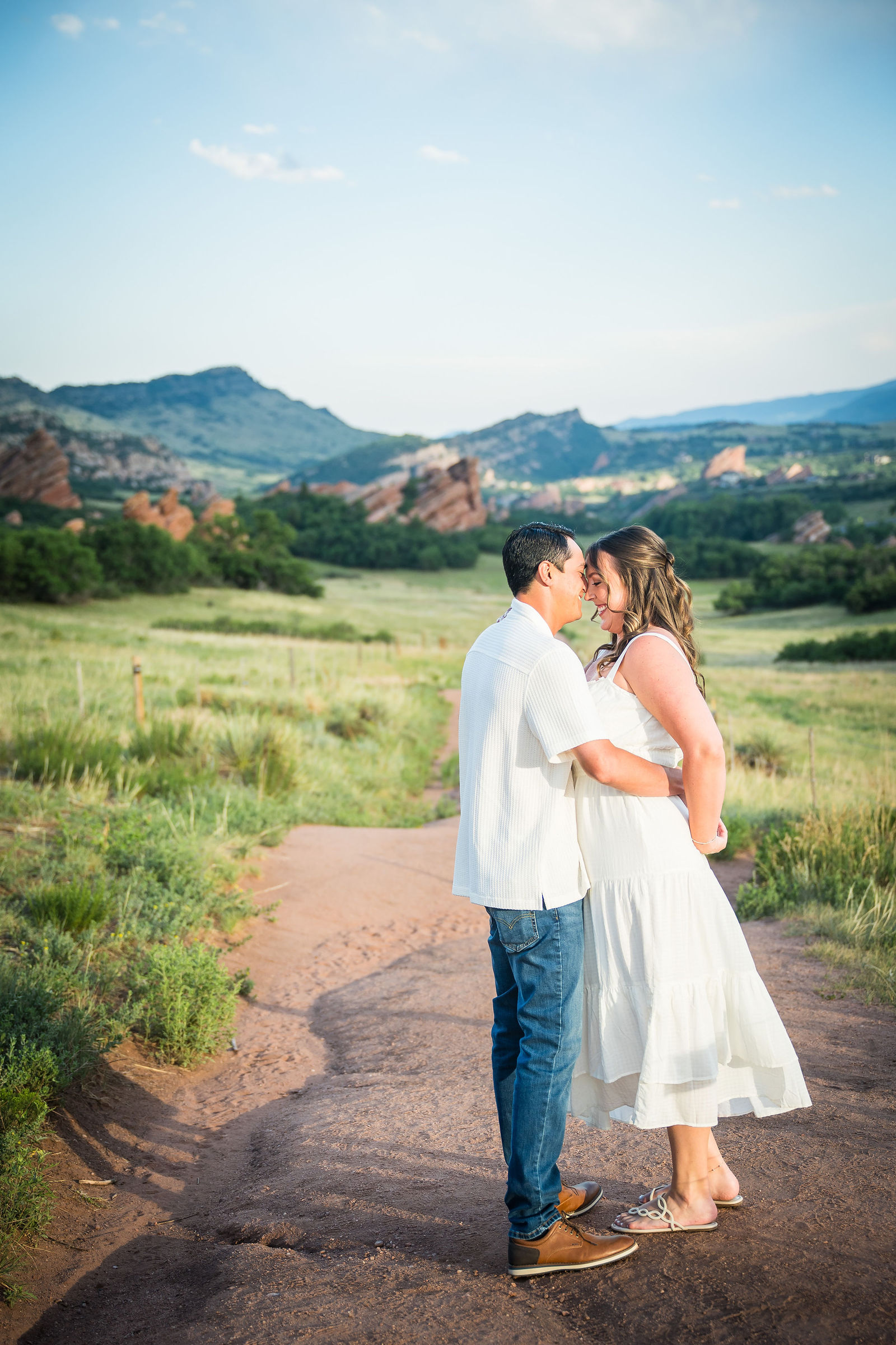 Engagement photos in the Colorado foothills with golden evening light