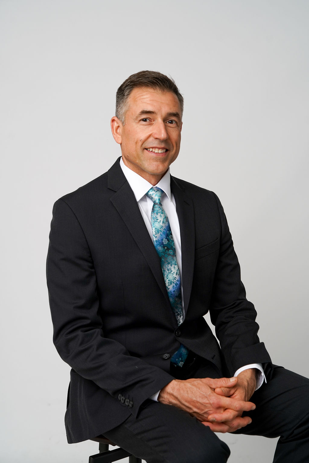 John Marek professional headshot — confident pose
