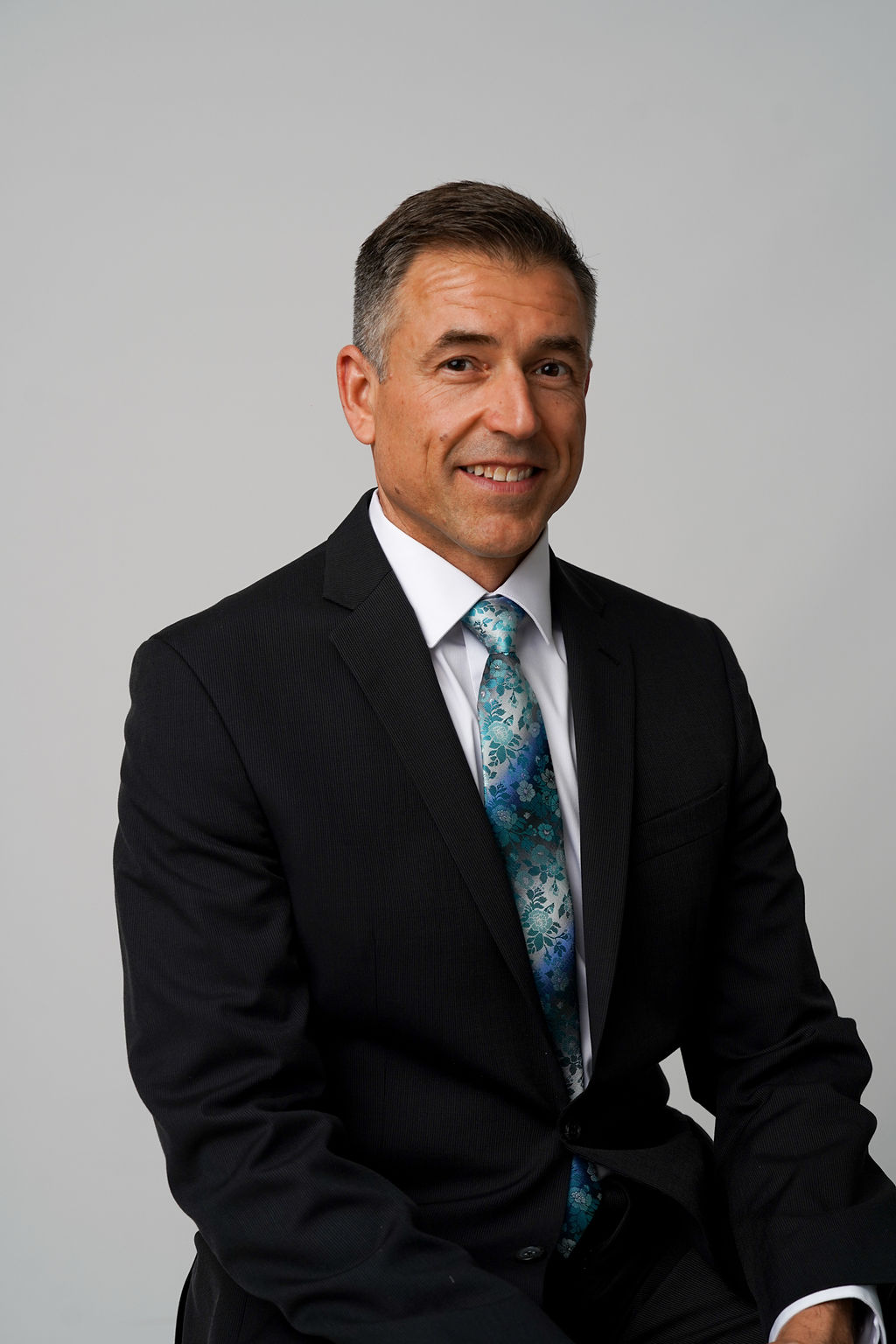 Clean modern headshot of John Marek