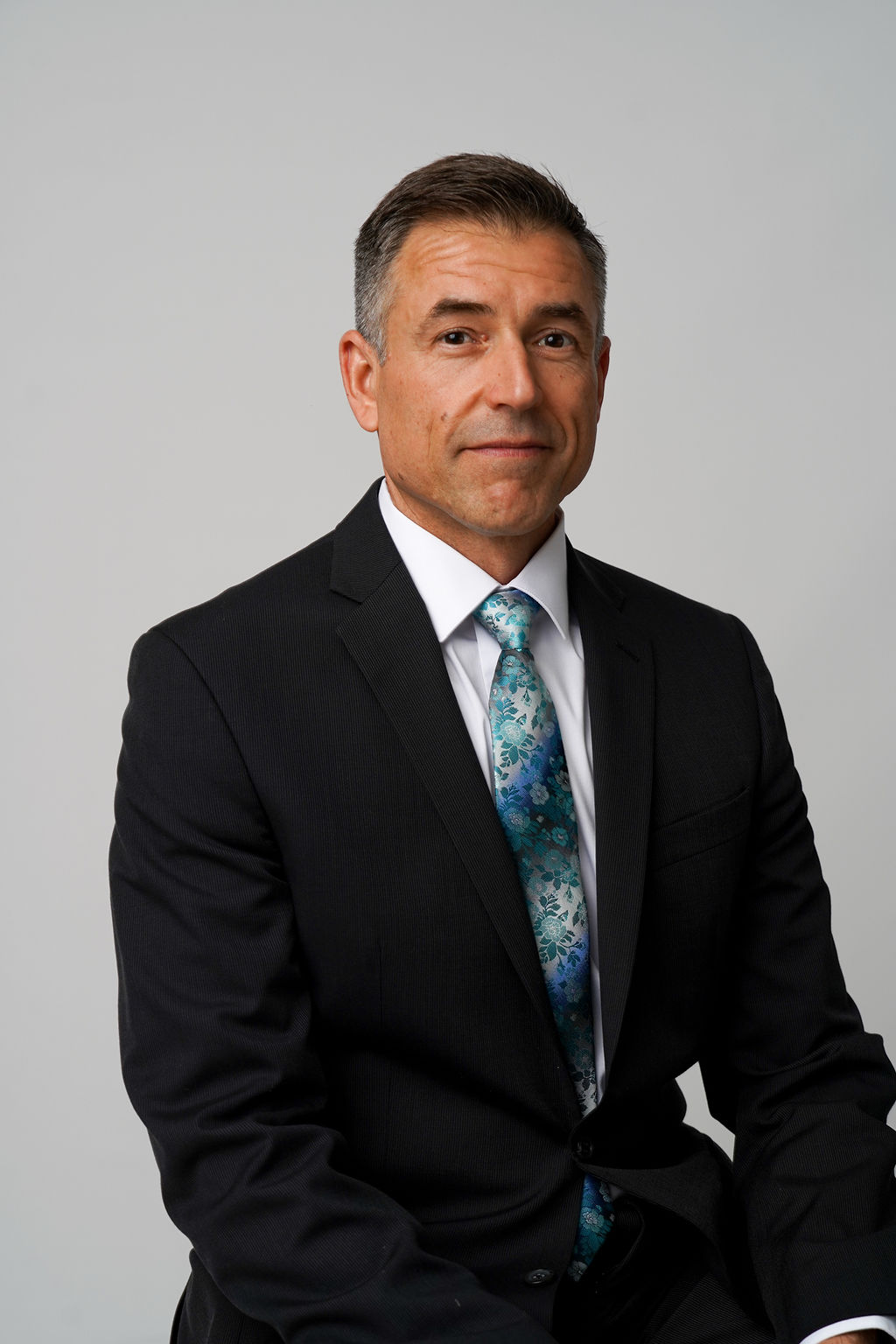 Polished professional portrait of John Marek
