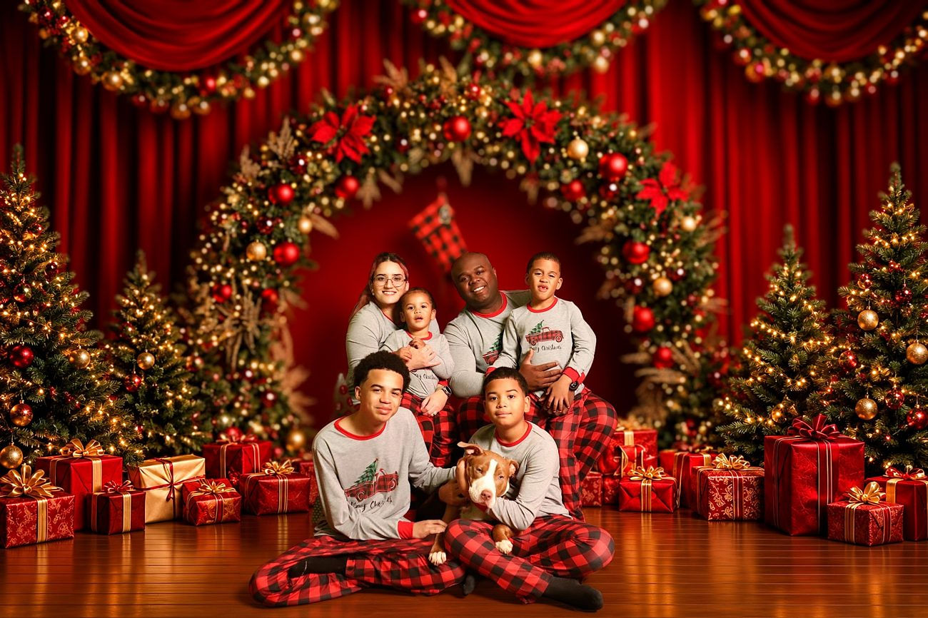 Three women in festive red outfits in a holiday portrait