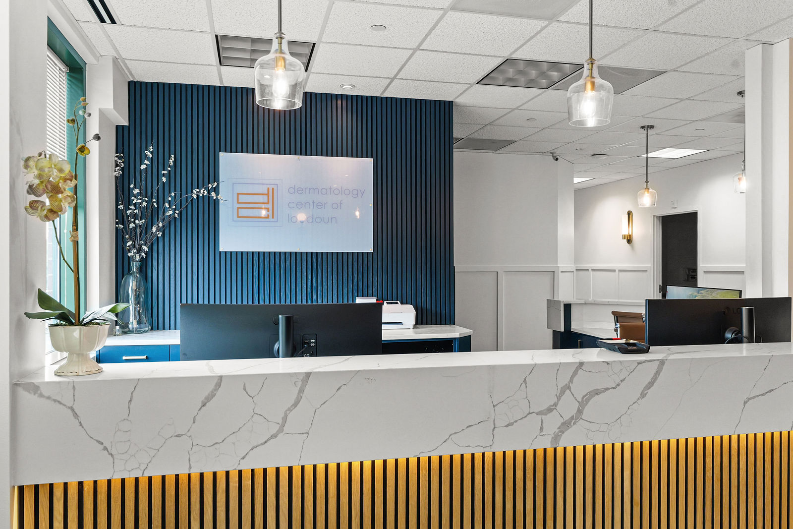 Architectural photo of a clinic reception with marble desk