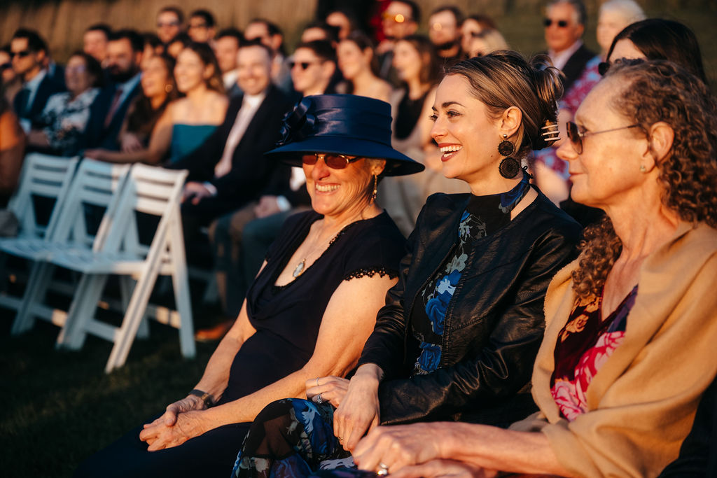 Guests laughing during the ceremony