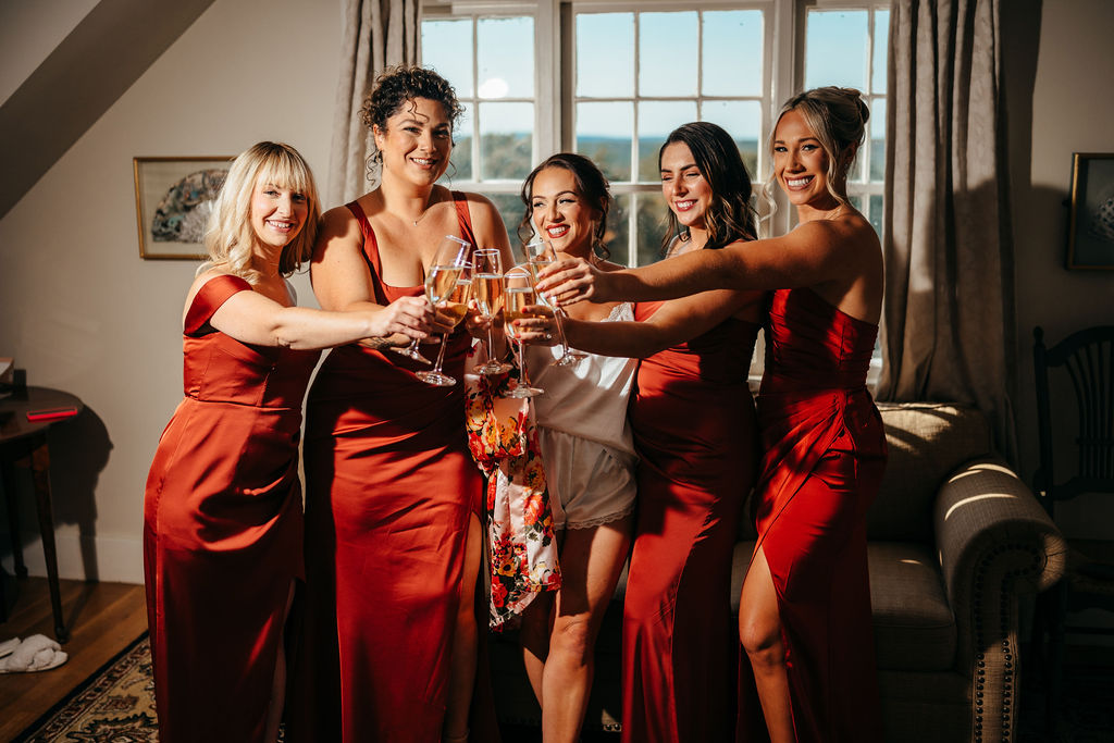 Bridesmaids toasting champagne with Samantha