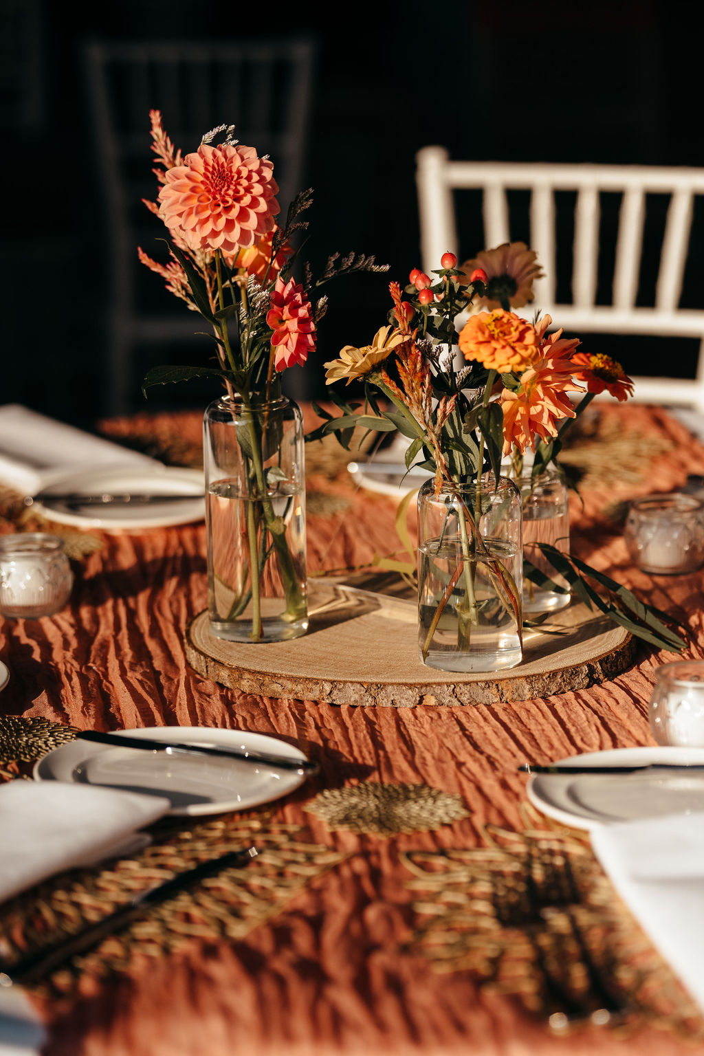Coral dahlias in bud vases