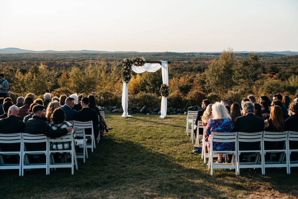 Samantha and McCallum at the altar with the valley behind them