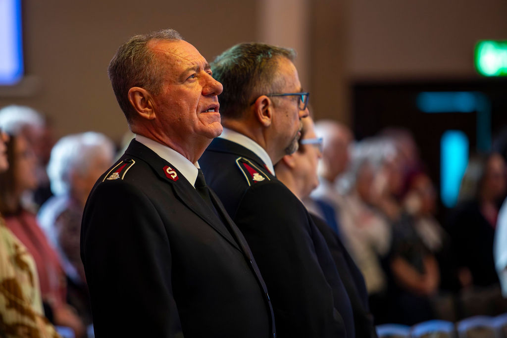 Two officers listening during the rally