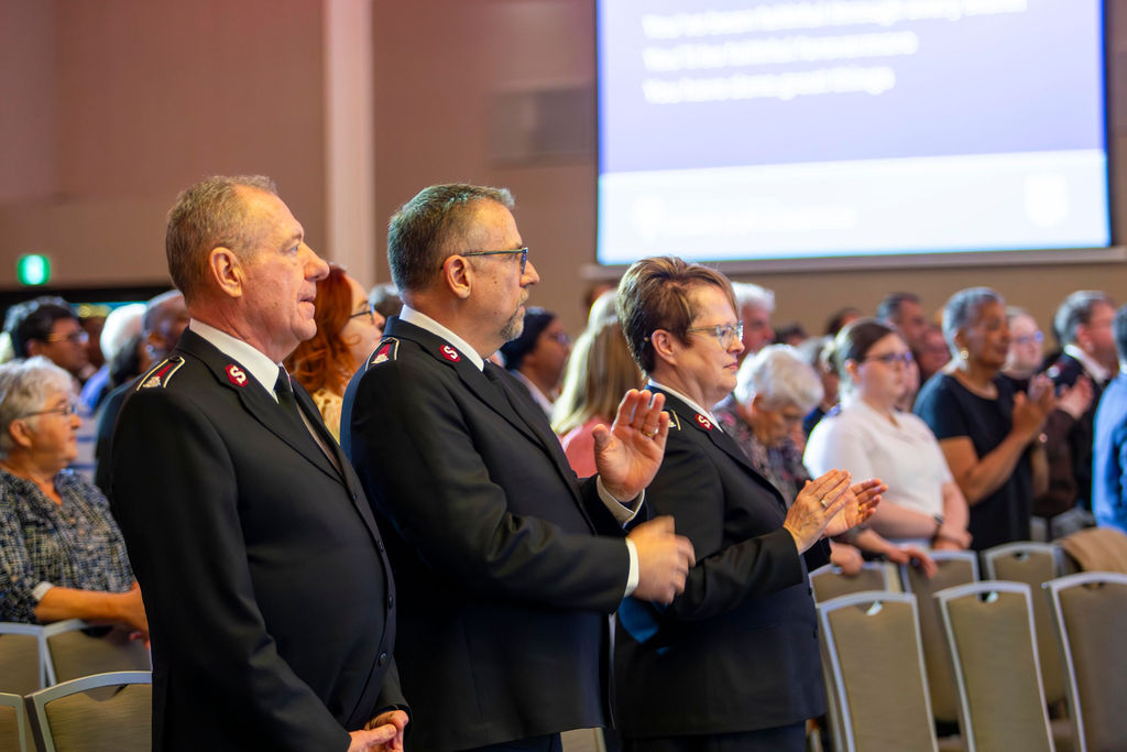Officers clapping during worship