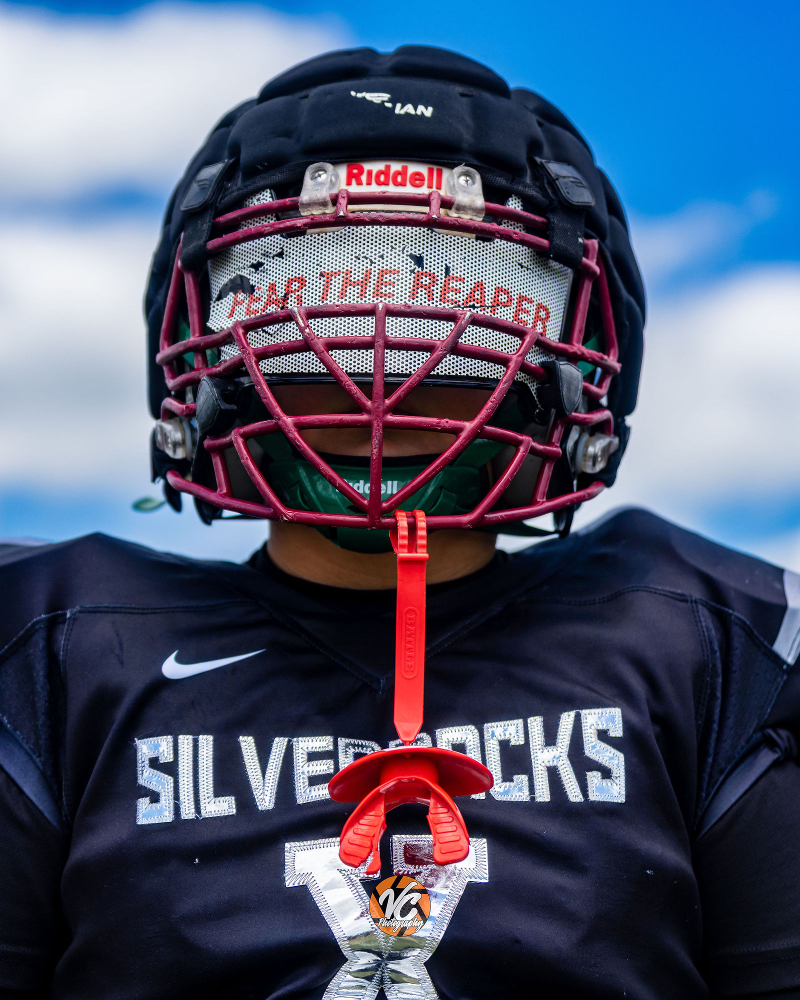 Youth football action photography of SilverBacks athlete competing against the Outlaws