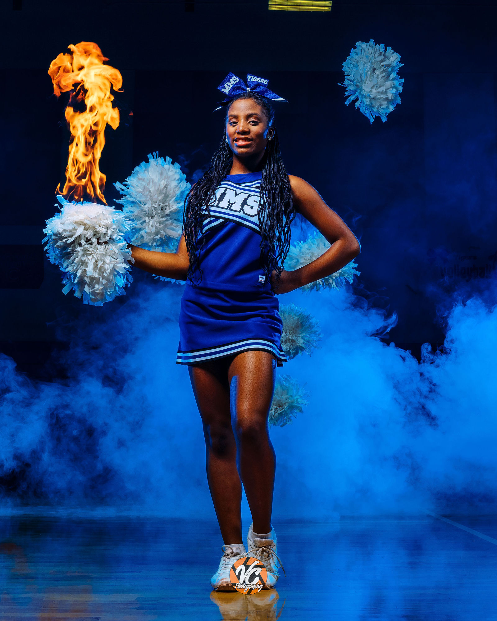 Austin area sports photographer creating dramatic cheer portraits for McCormick Tigers