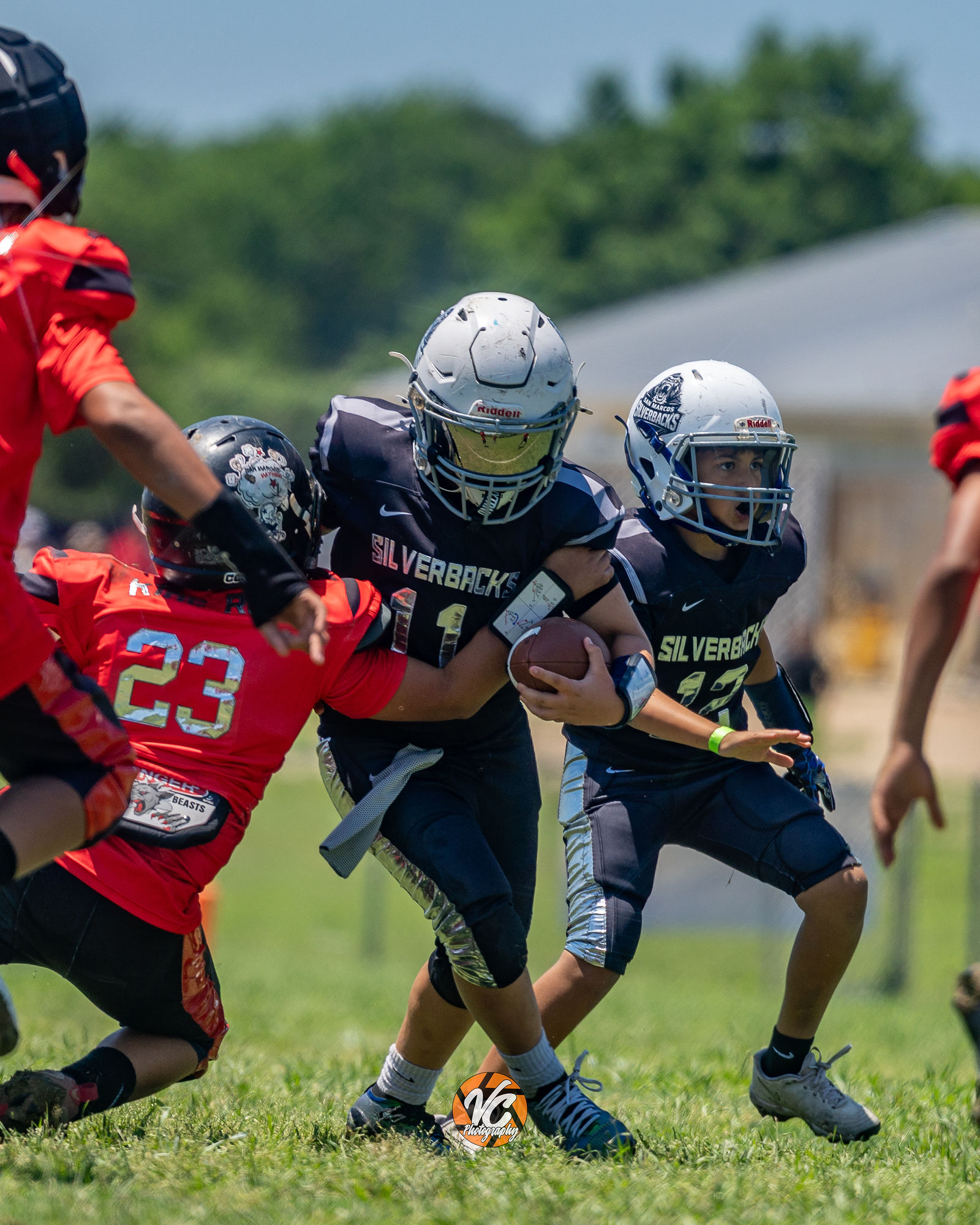 Bulldogs football action image from a competitive 10U matchup in San Marcos Texas