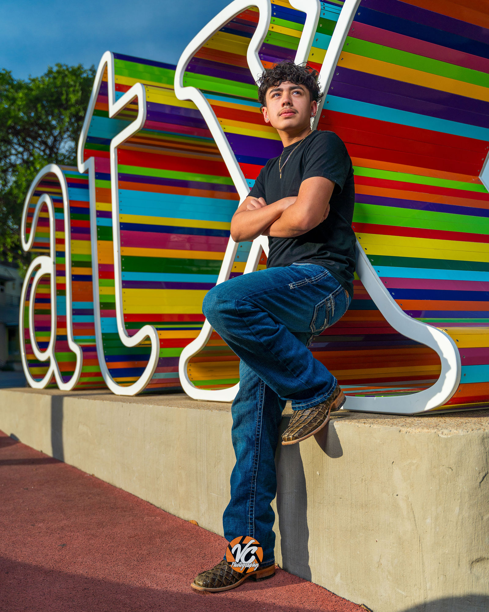 Downtown Austin creative portraits of Peyton and Jesse near the ATX Sign