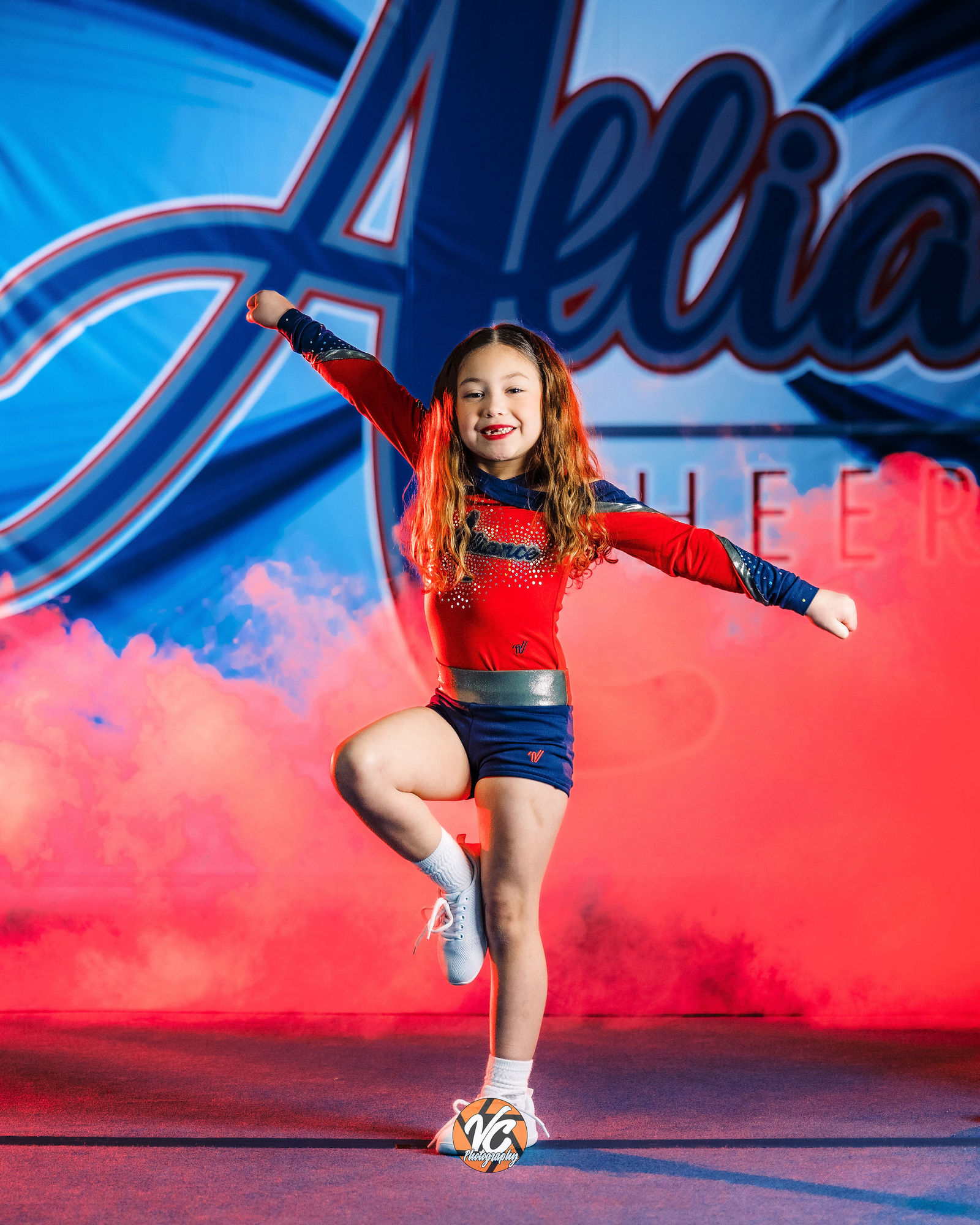 Alliance Cheer athlete portrait with cinematic sports lighting in Buda TX