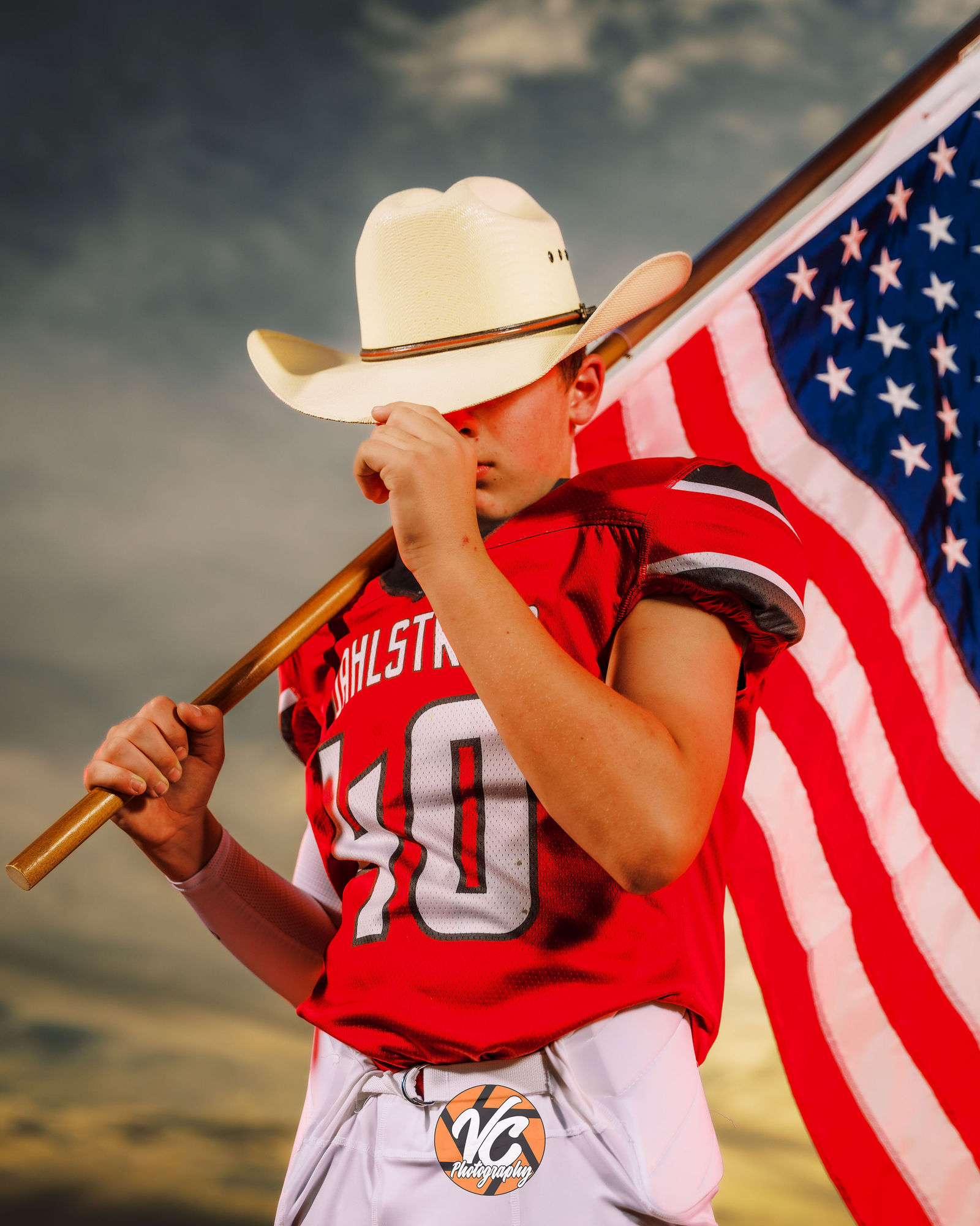 Buda middle school football player Owen wearing chains in a bold cinematic sports portrait