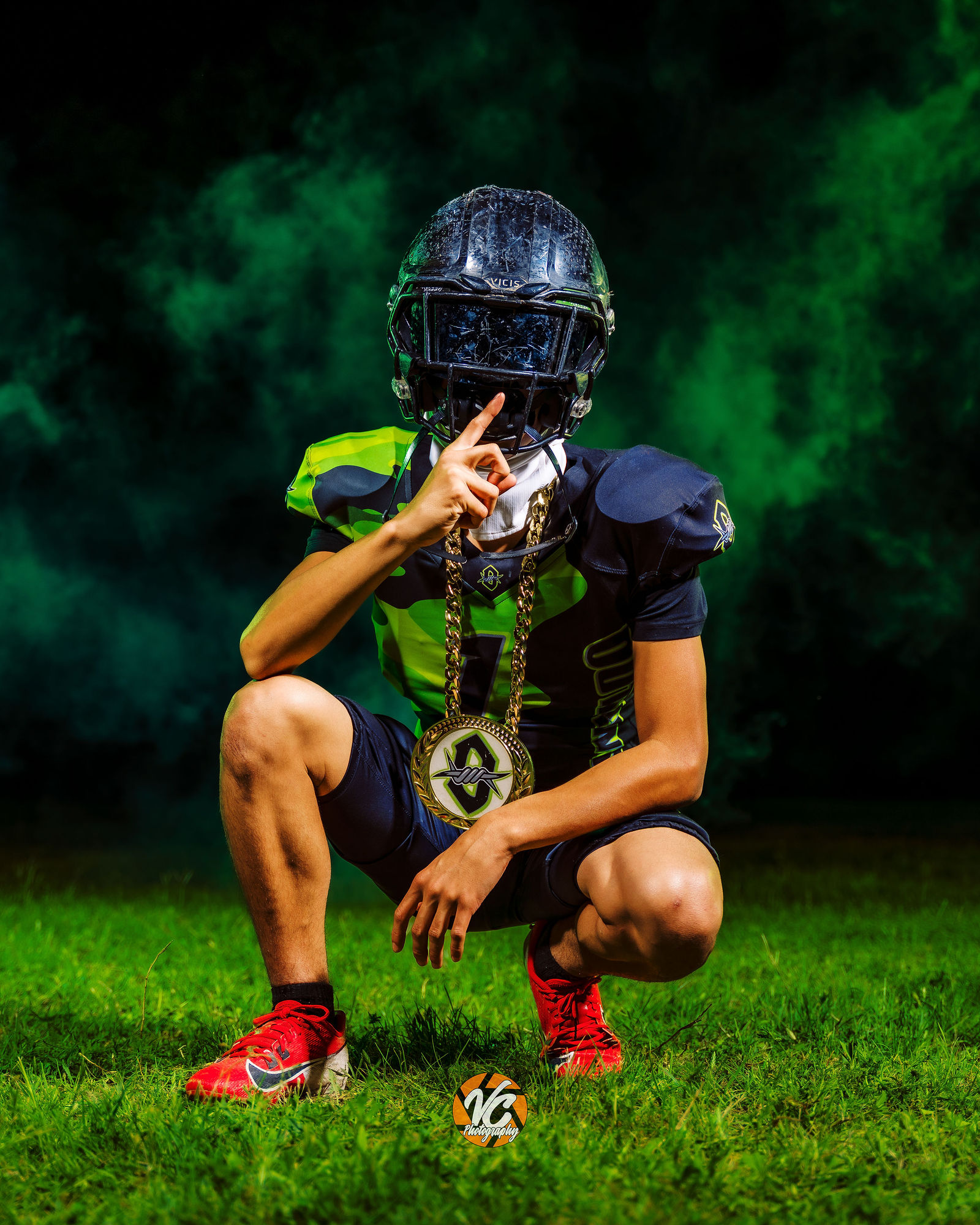 Hays Outlaws youth football athlete posing with a football during a cinematic media day at Stagecoach Park in Buda Texas