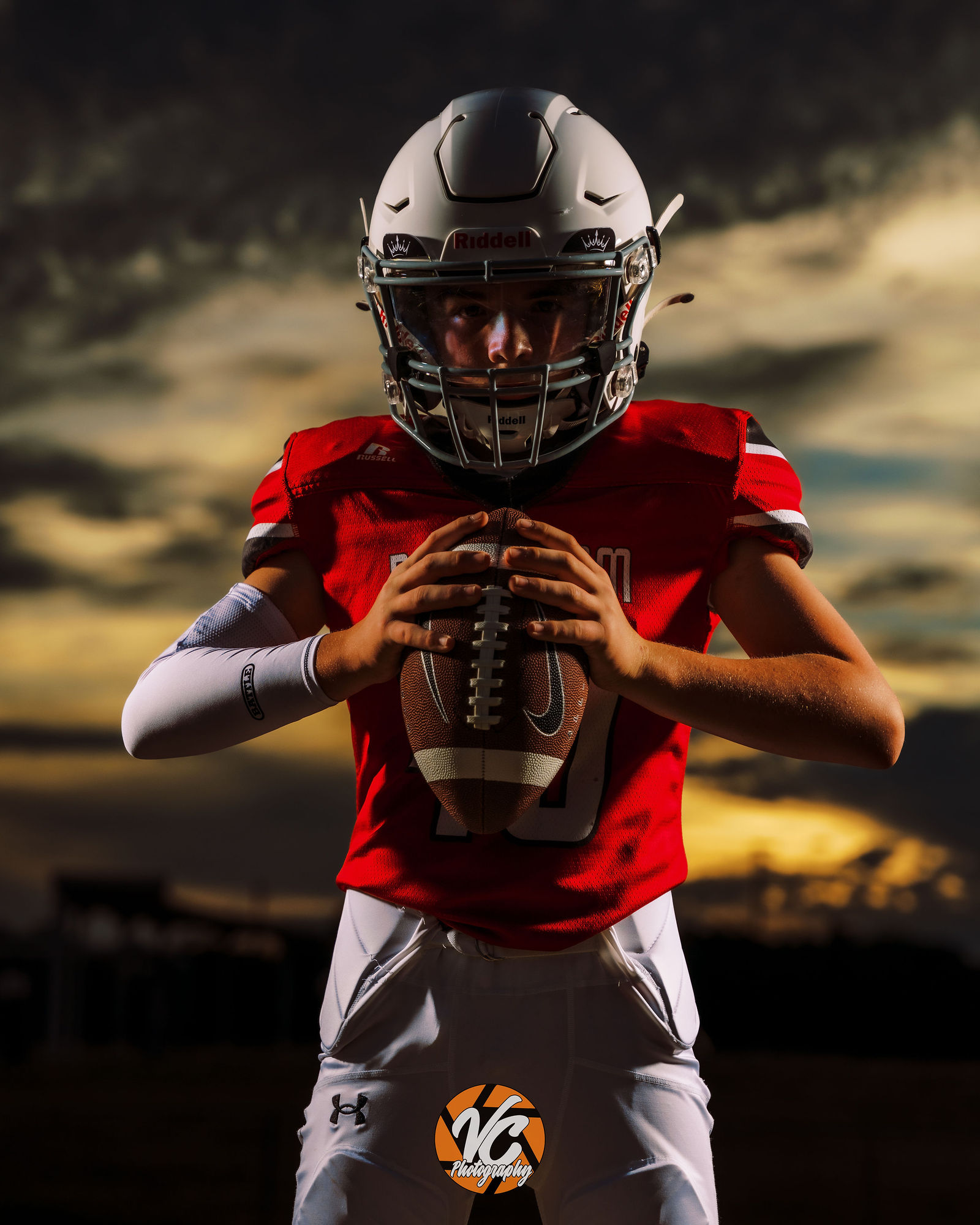 Dahlstrom Middle School football athlete Owen posing with a flag during an individual media day in Buda