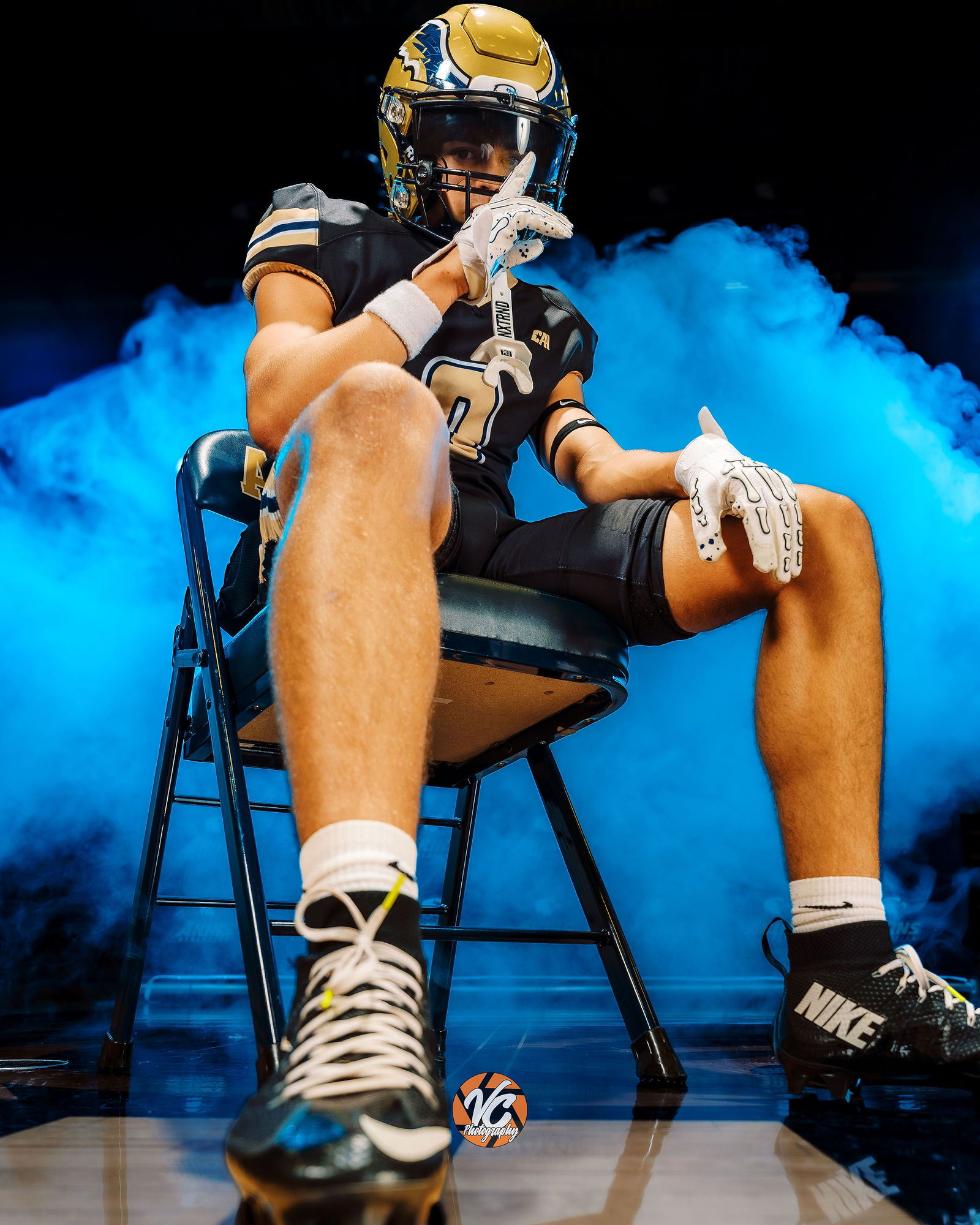 Cinematic varsity football media day portrait for Akins High School in Austin Texas