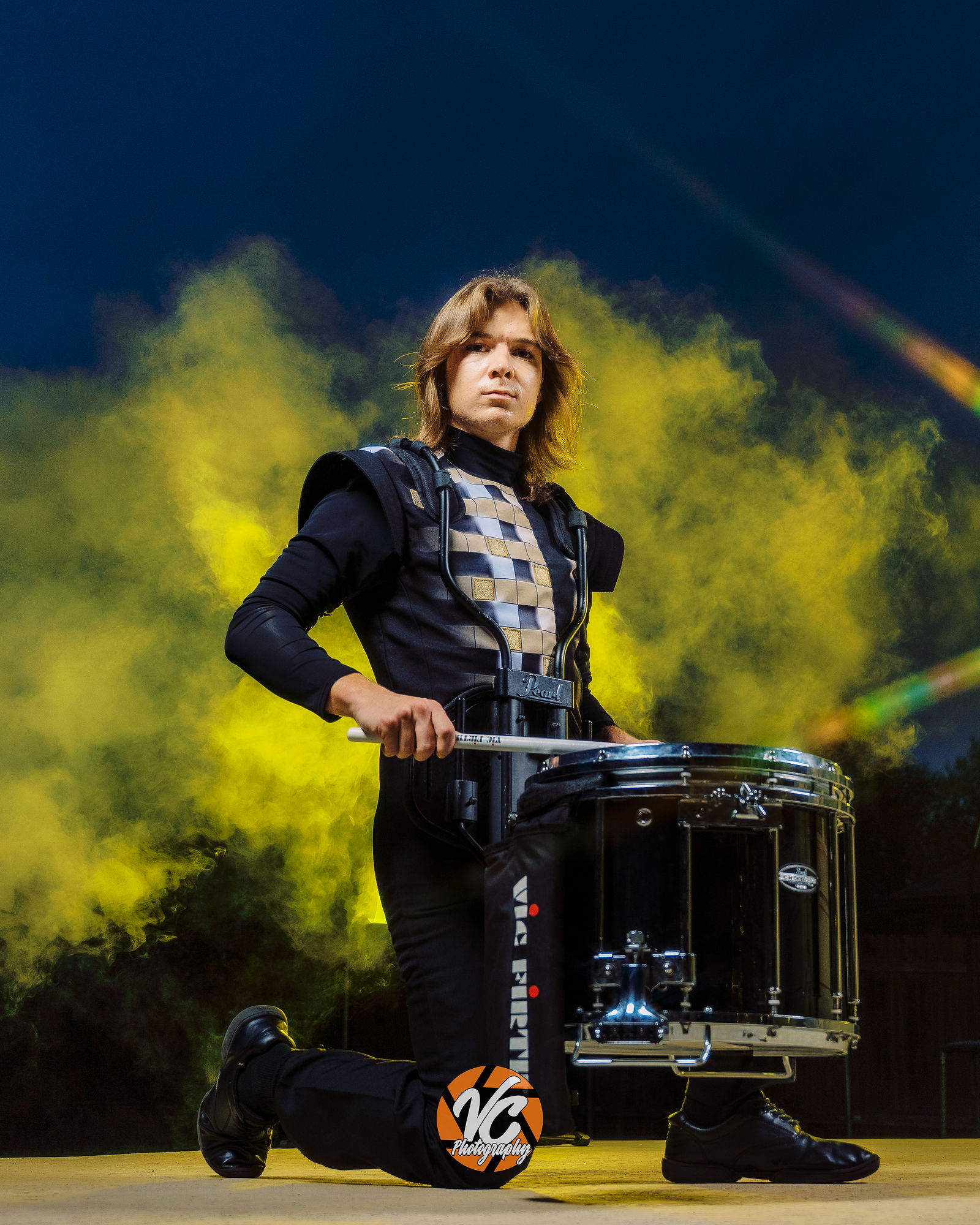 Bold individual media day portrait of Johnson High School drummer Chase Urbanovsky photographed in Buda Texas