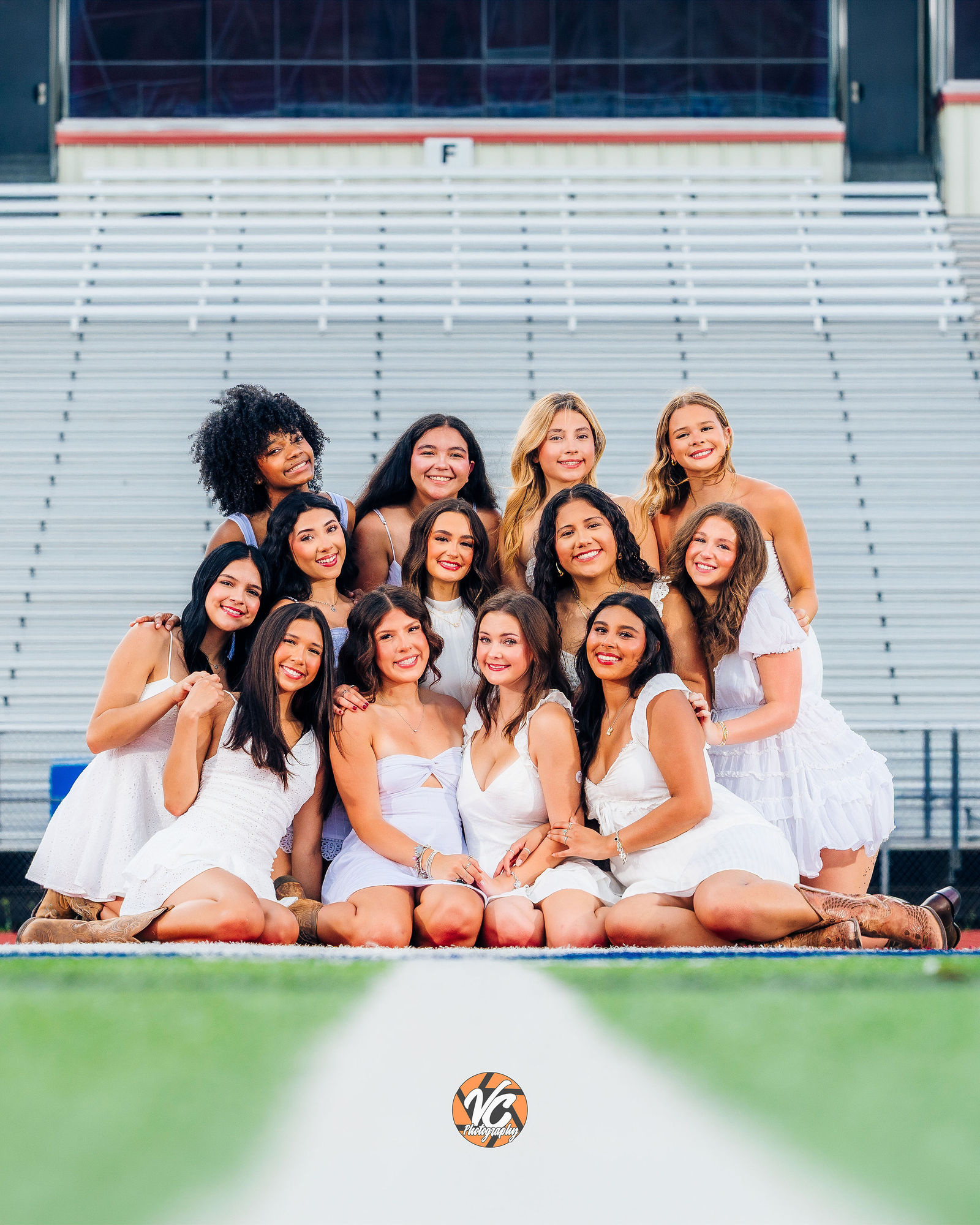 Hays cheer senior photographed in uniform during a bold high school senior portrait session