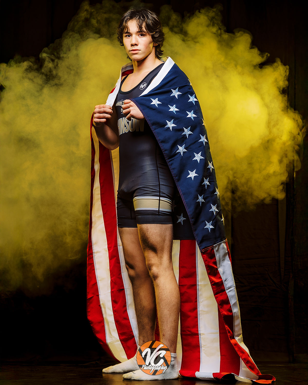 Johnson Jaguars wrestling athlete photographed in a cinematic smoke portrait