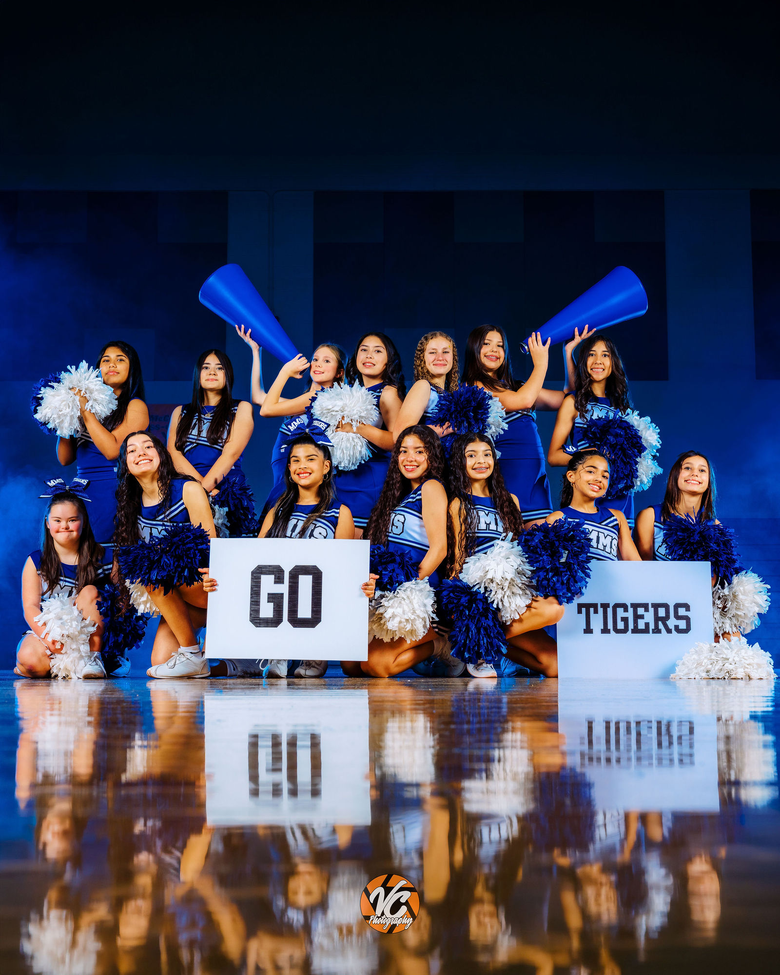 McCormick Tigers 8th Grade cheer portrait with smoke and dramatic sports lighting