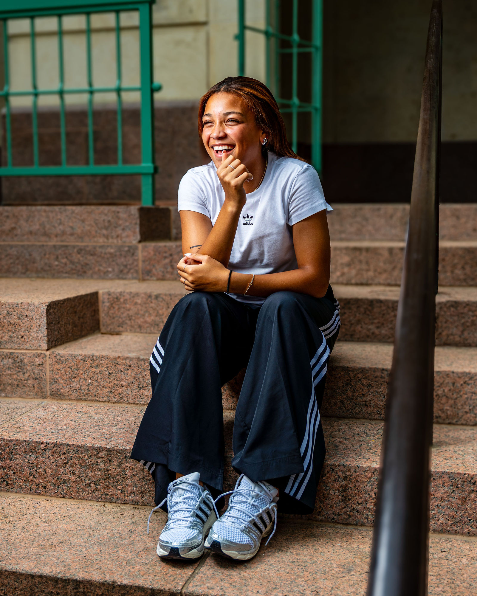 Lifestyle athlete branding portrait on campus steps