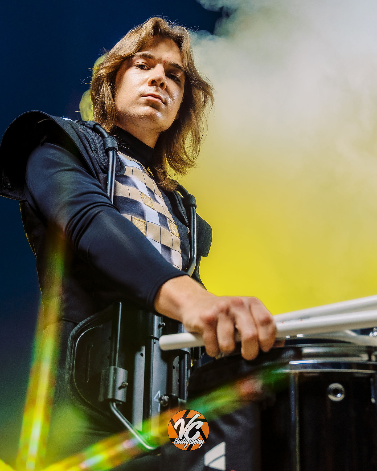 Cinematic portrait of Johnson High School drummer Chase Urbanovsky during a band media day session in Buda Texas