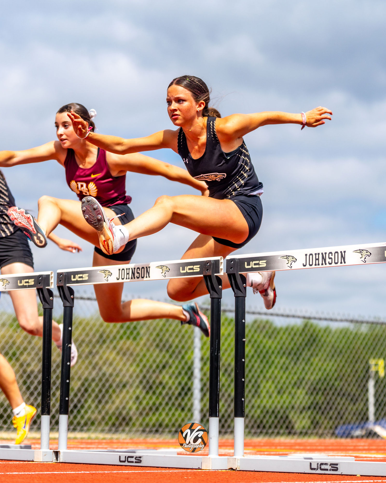 Johnson Track running events action photo with competitive race energy