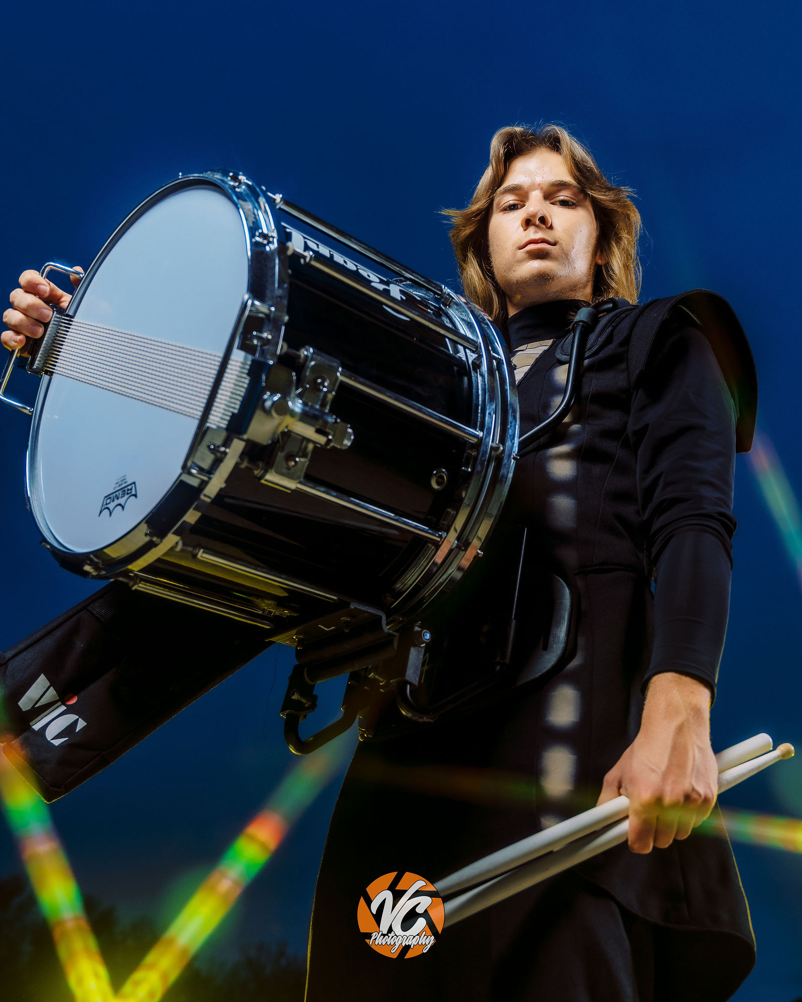 Creative high school band portrait of Chase Urbanovsky with cinematic smoke and drummer equipment in Buda