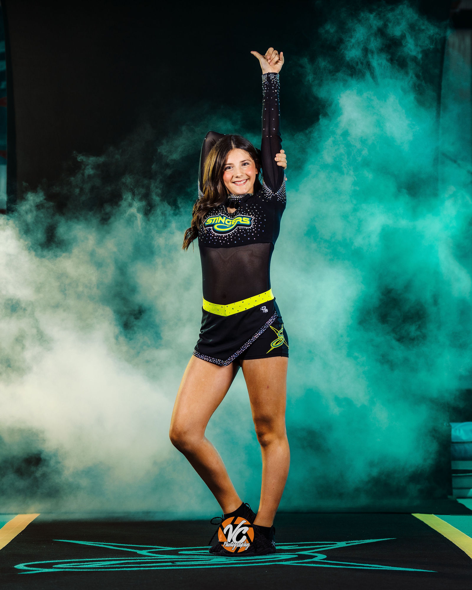 San Marcos cheer athlete portrait with bold lighting by Austin sports photographer VC Photography