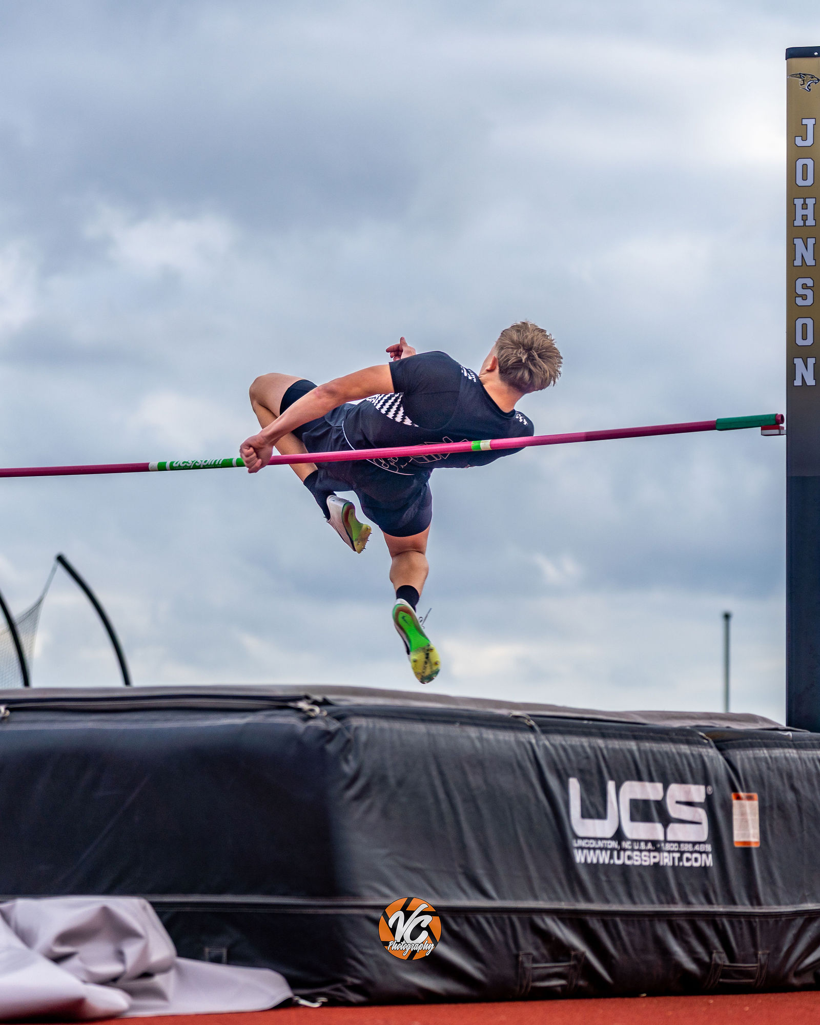 High school track athlete action photo at Johnson Football Fields