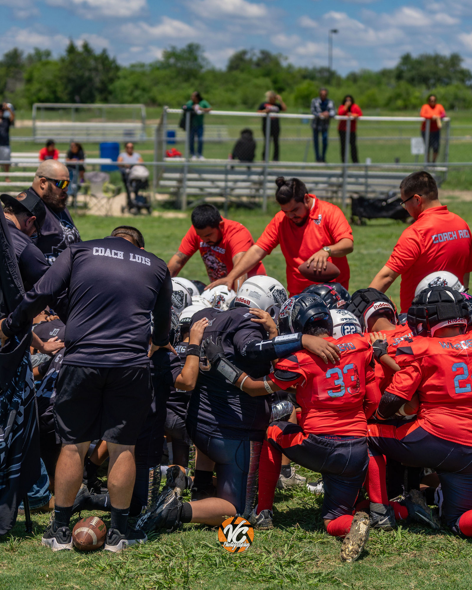 Bulldogs football player running during youth action photography coverage at CFPO Field