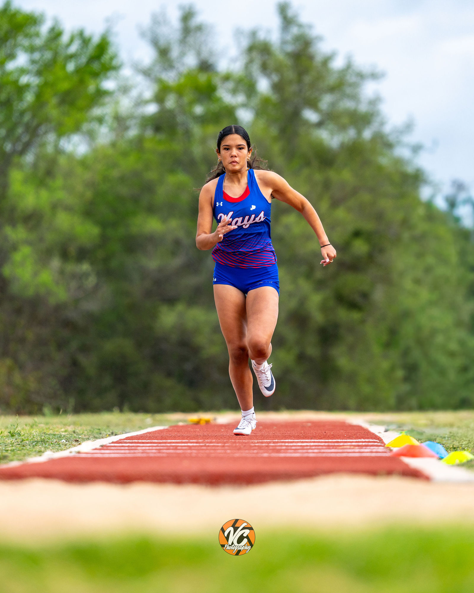 Johnson Jaguars track athlete running event action photo in Buda TX