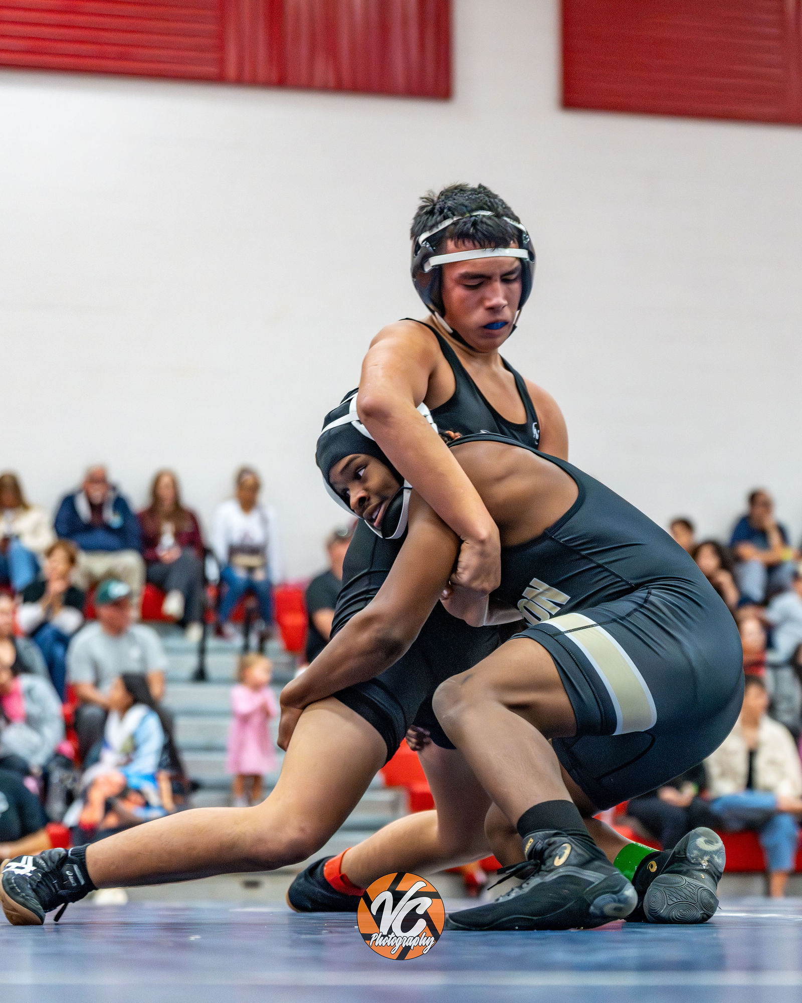 Round Rock Georgetown Pflugerville area sports photographer capturing wrestling action