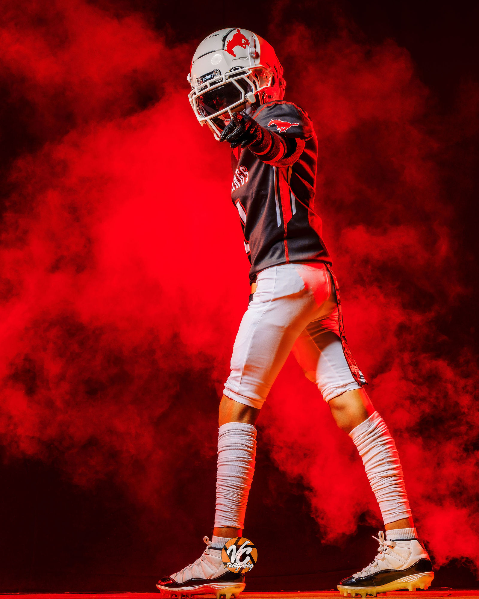 Buda Texas football media day portrait with dramatic lighting and new uniform reveal