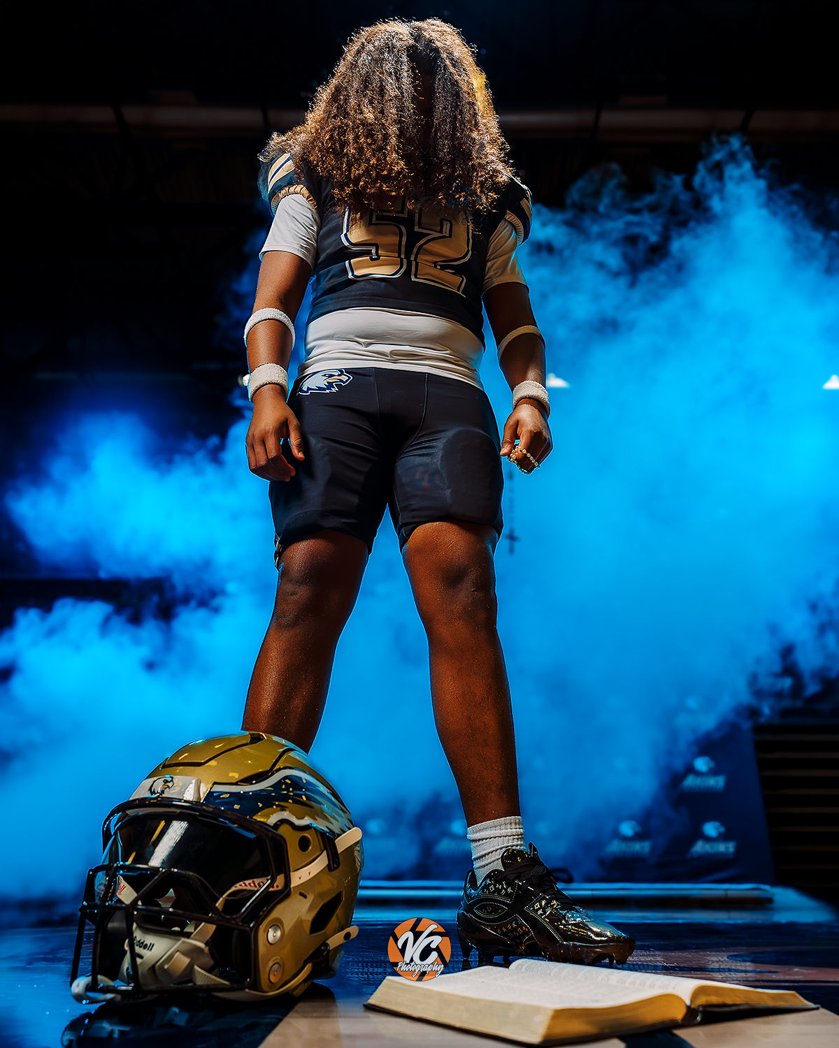 Varsity Akins Eagles football athlete featured in a high-impact Austin sports media day portrait