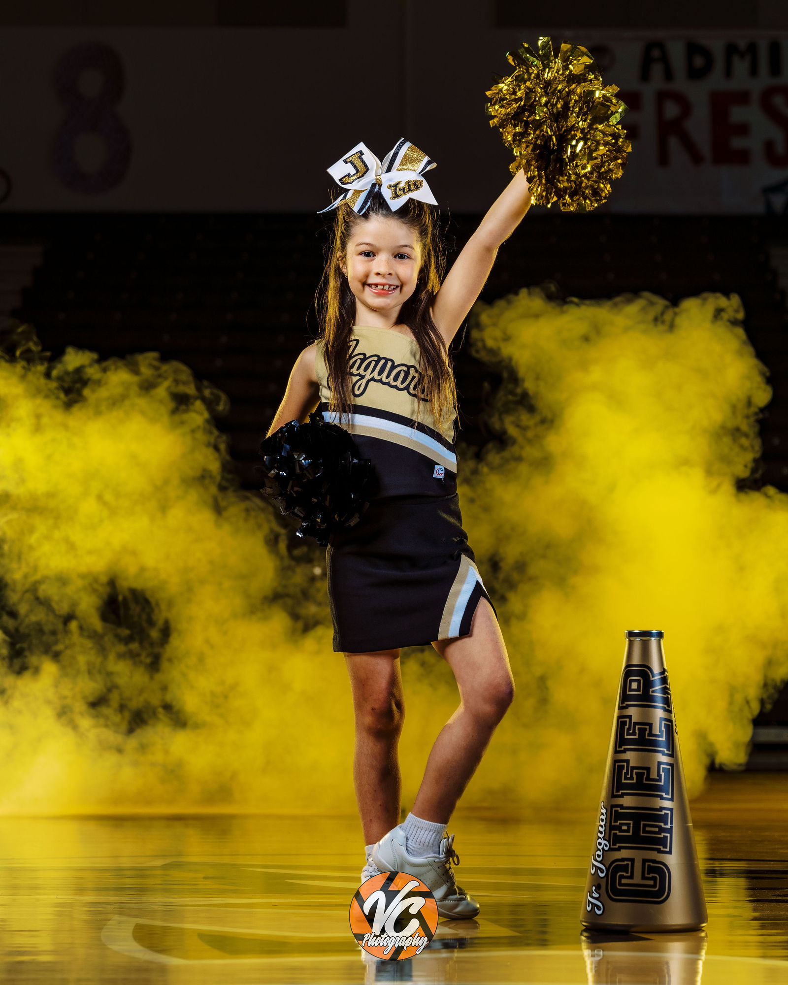 Jr Jags Cheer athlete portrait with cinematic lighting and smoke in Buda TX