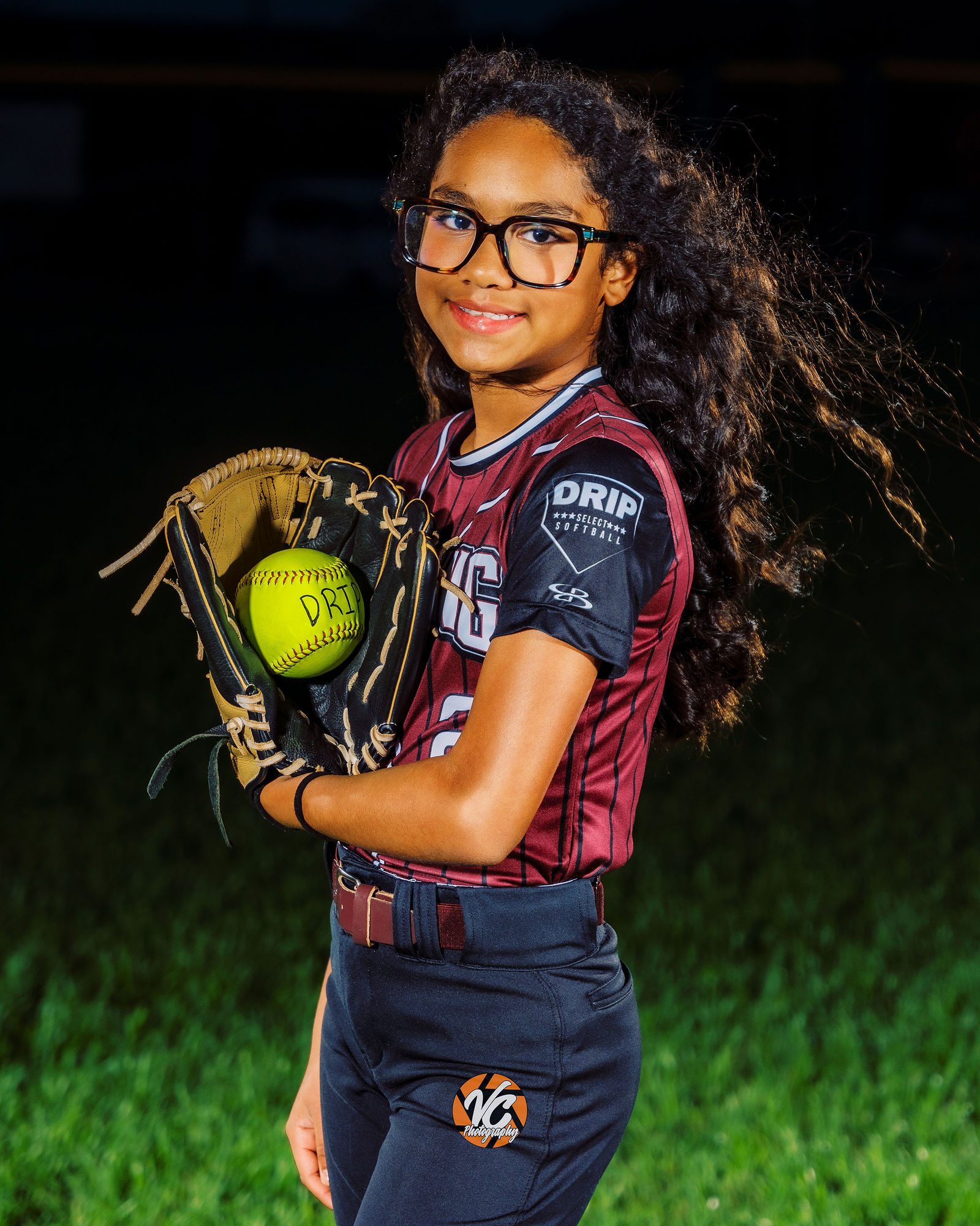 Dripping Springs softball portrait with cinematic sports lighting and athlete confidence