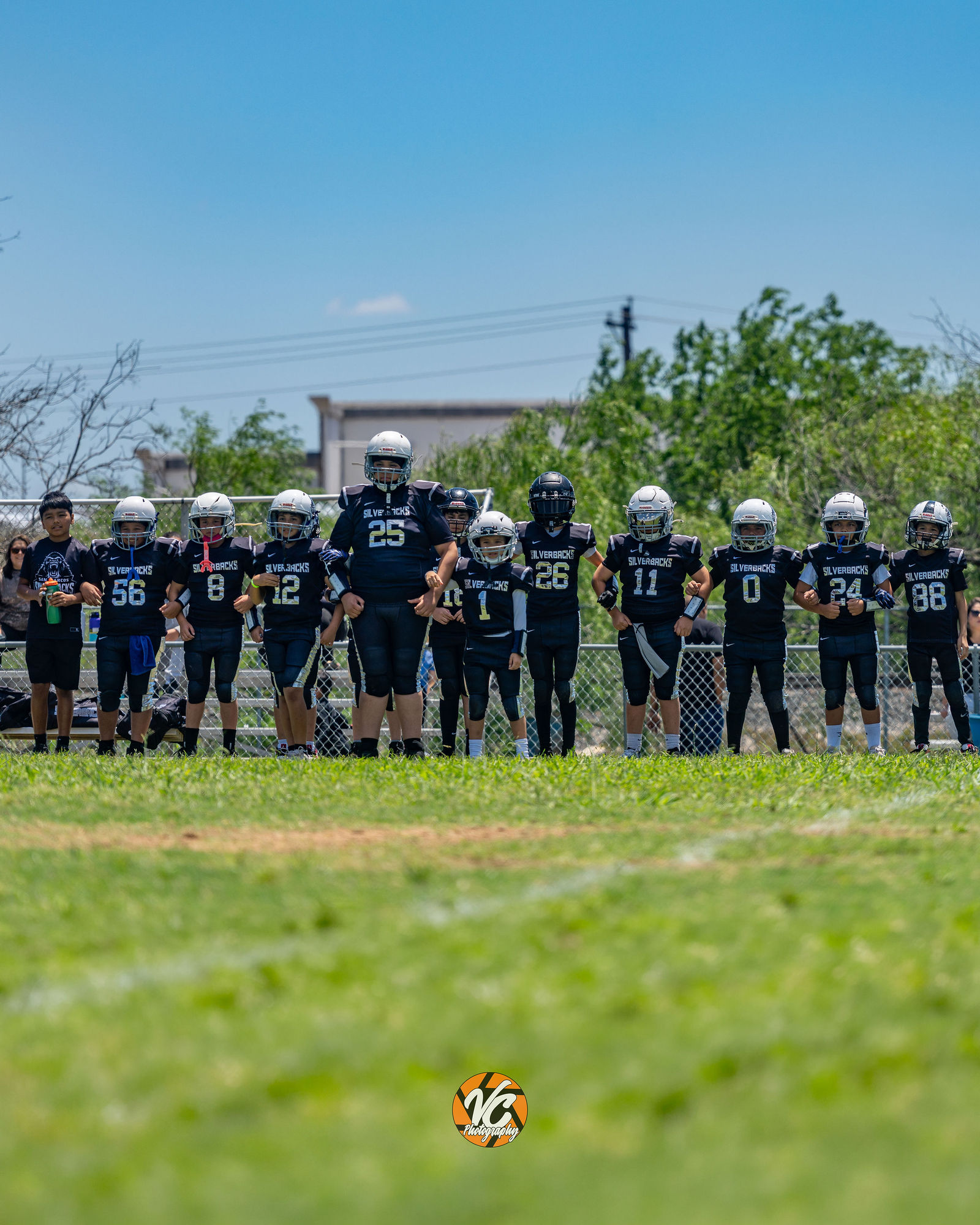 Youth football player fighting for yards during Bulldogs vs Silverbacks action coverage